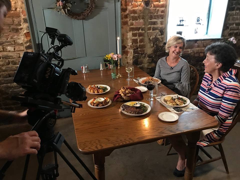 Television crew filming a feature story at The Half-Way House dining room